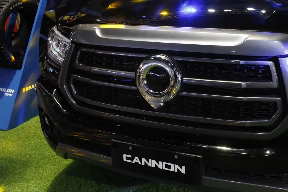Close-up of GWM Cannon front grille showing badge, headlights and rugged ute styling